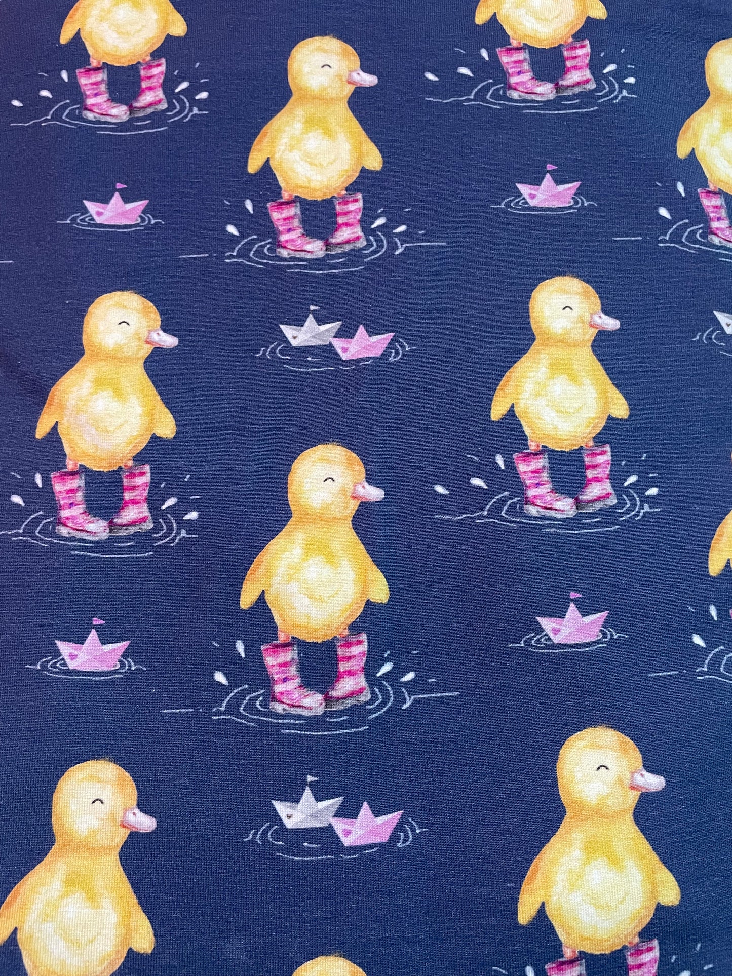 Ducks in pink wellies on navy