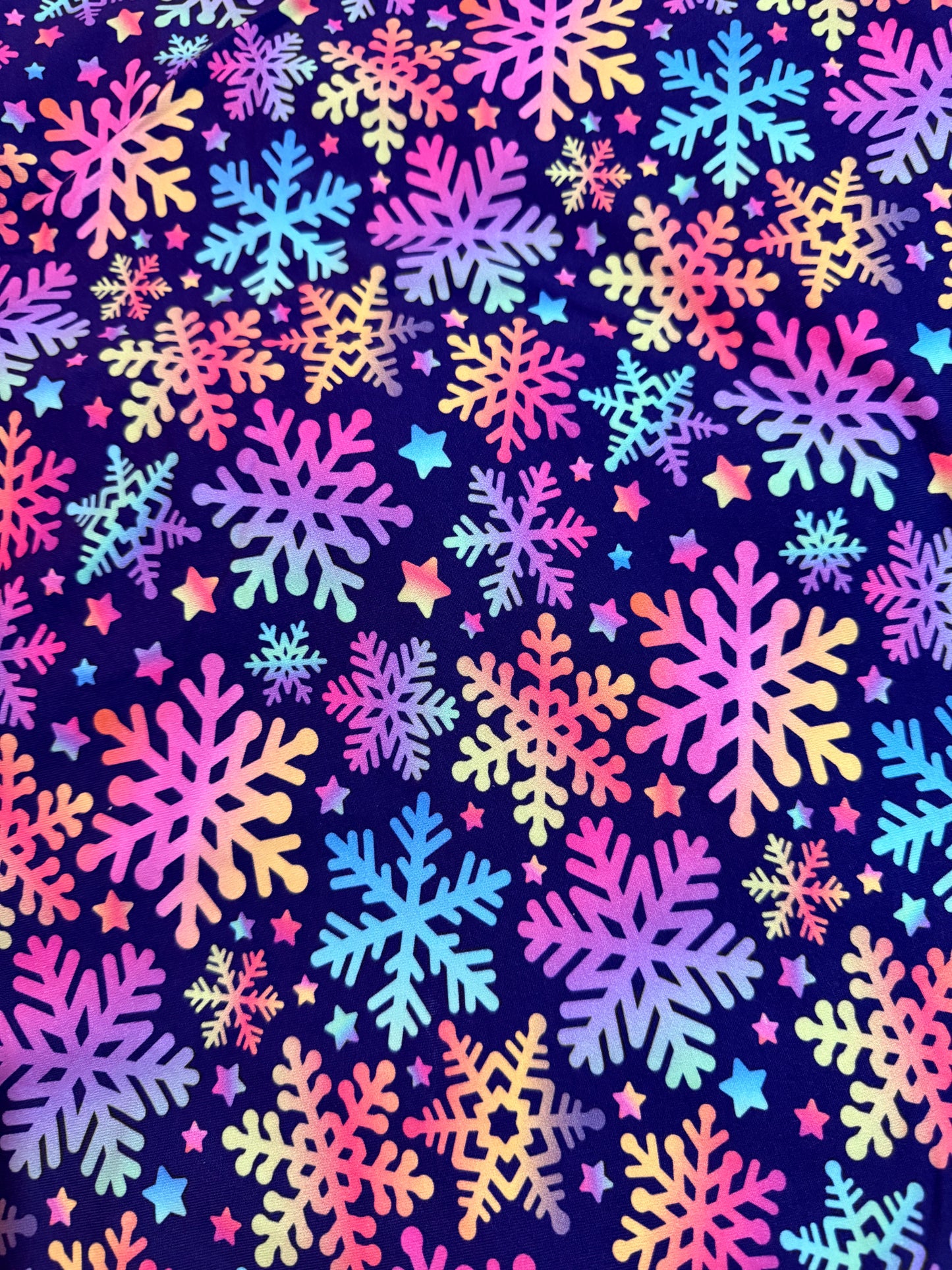 Multicoloured snowflakes on blue