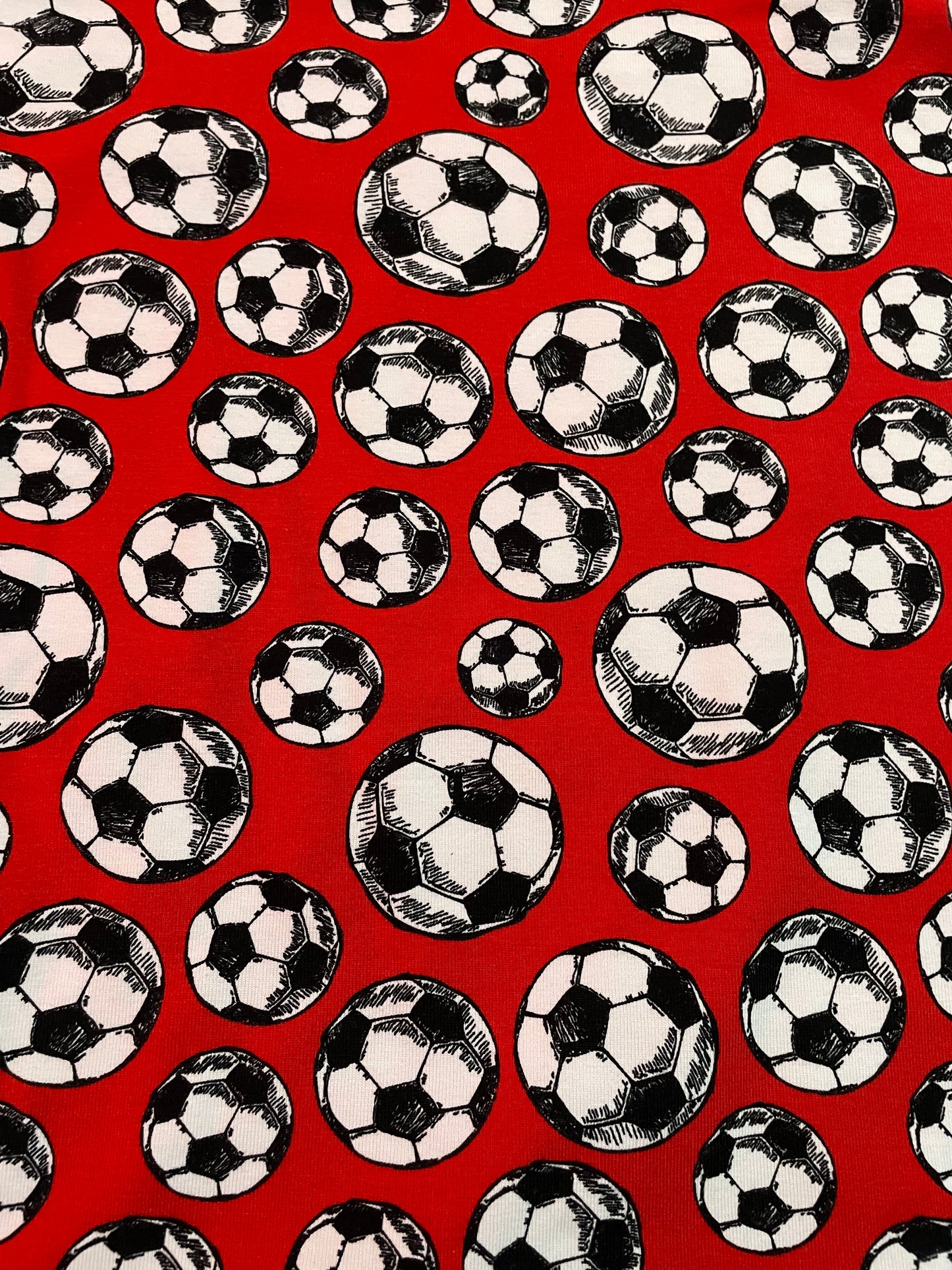 Footballs on red
