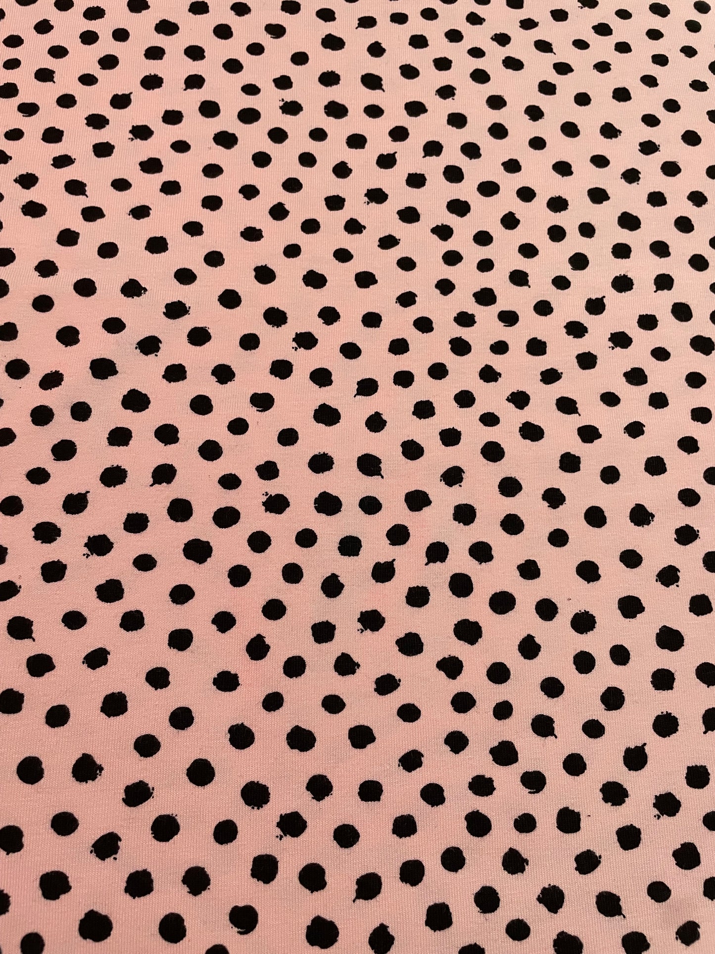 Black dots on pink