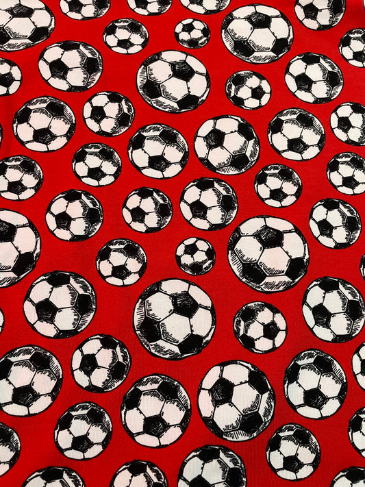 Footballs on red 5y+