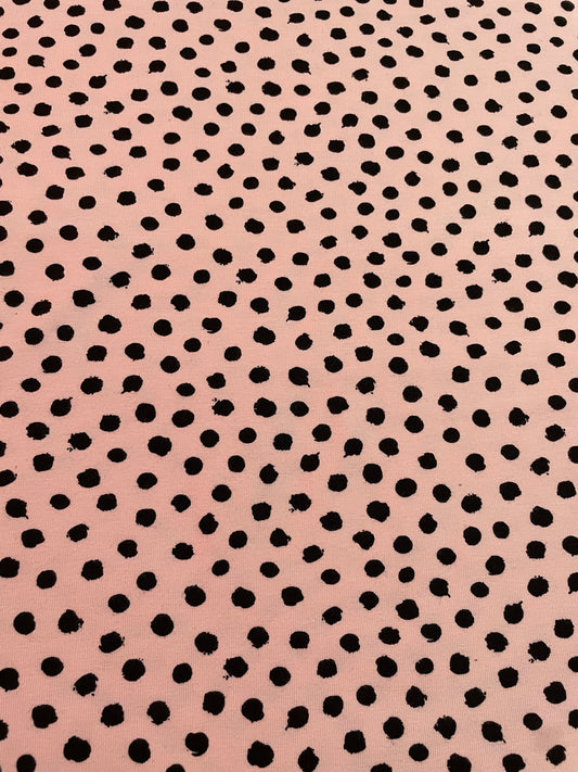 Black dots on pink